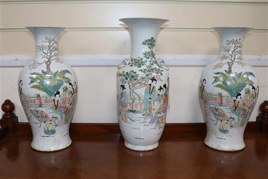 A pair of vases and one other